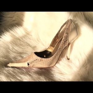 Pointy red bottom python style stilettos. US sz 7